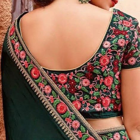 Floral thread embroidery on a green saree blouse